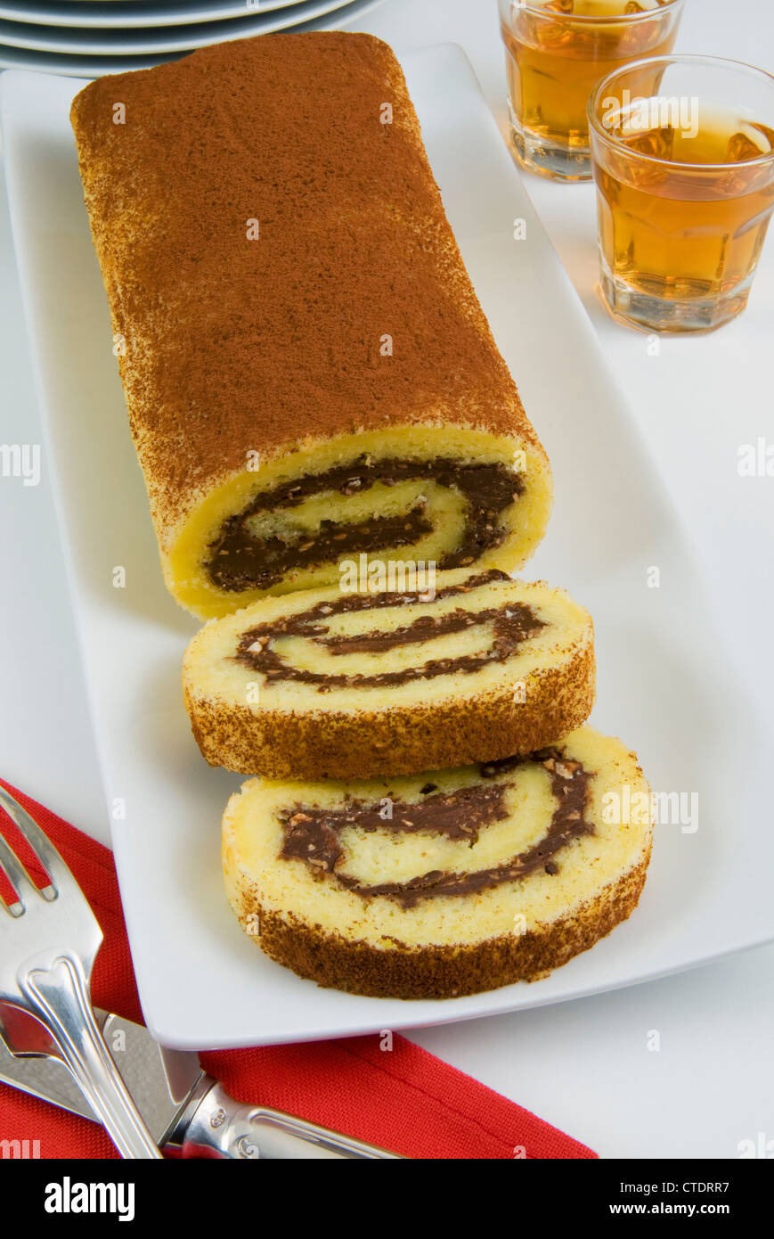 Roll of sponge cake with chocolate Stock Photo