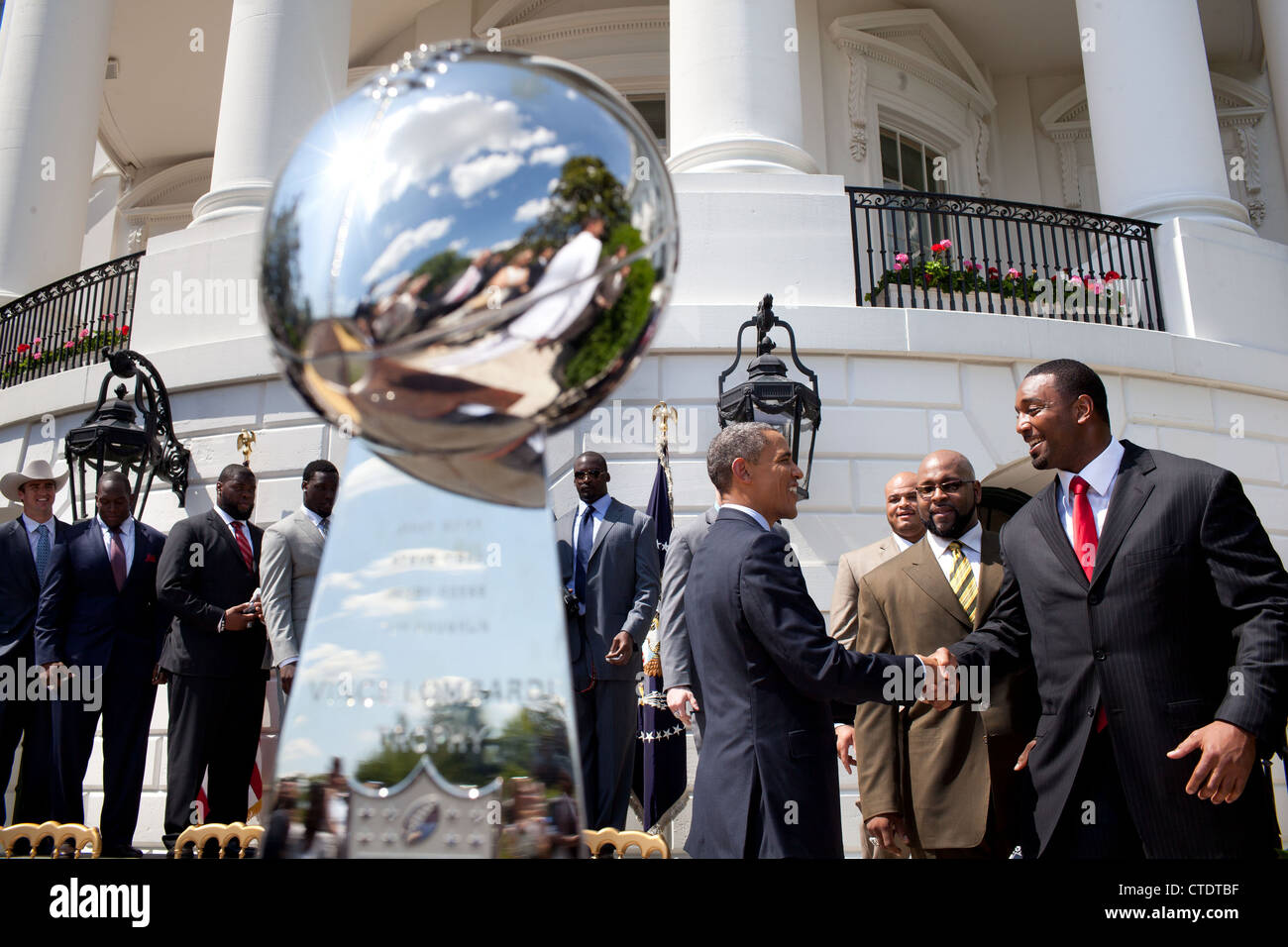 US President Barack Obama greets members of the Super Bowl Champion New York Giants on the South Lawn of the White House during a ceremony honoring the team for their Super Bowl XLVI victory June 8, 2012 in Washington, DC. Stock Photo