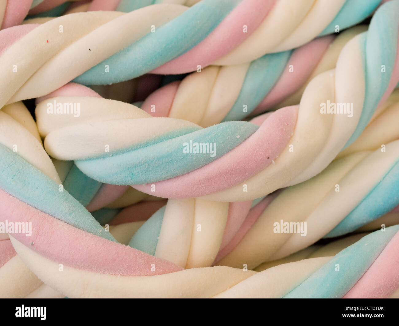 Closeup on a lot of colorful twisted marshmallow candy Stock Photo Alamy