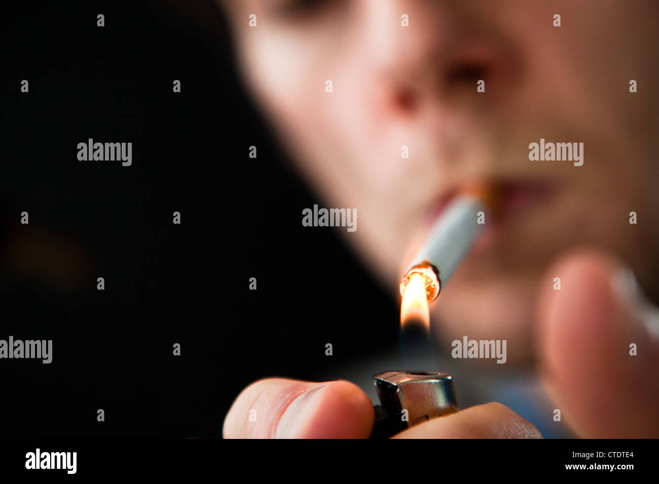 Man lighting a cigarette Stock Photo Alamy