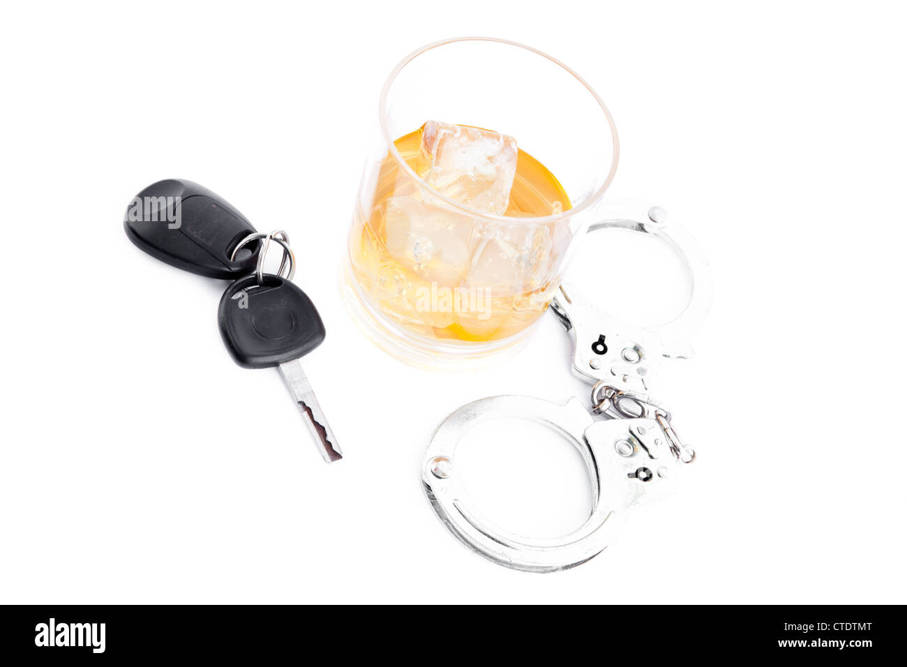 Tumbler glass with whiskey with car key and handcuff Stock Photo Alamy