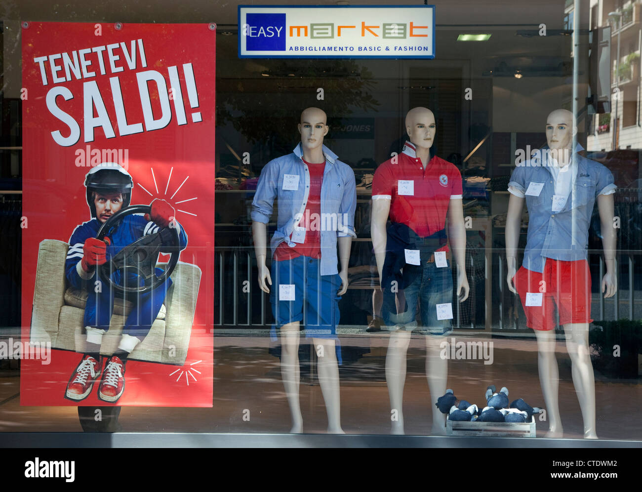 Sales sign in shop window in Florence, Italy Stock Photo