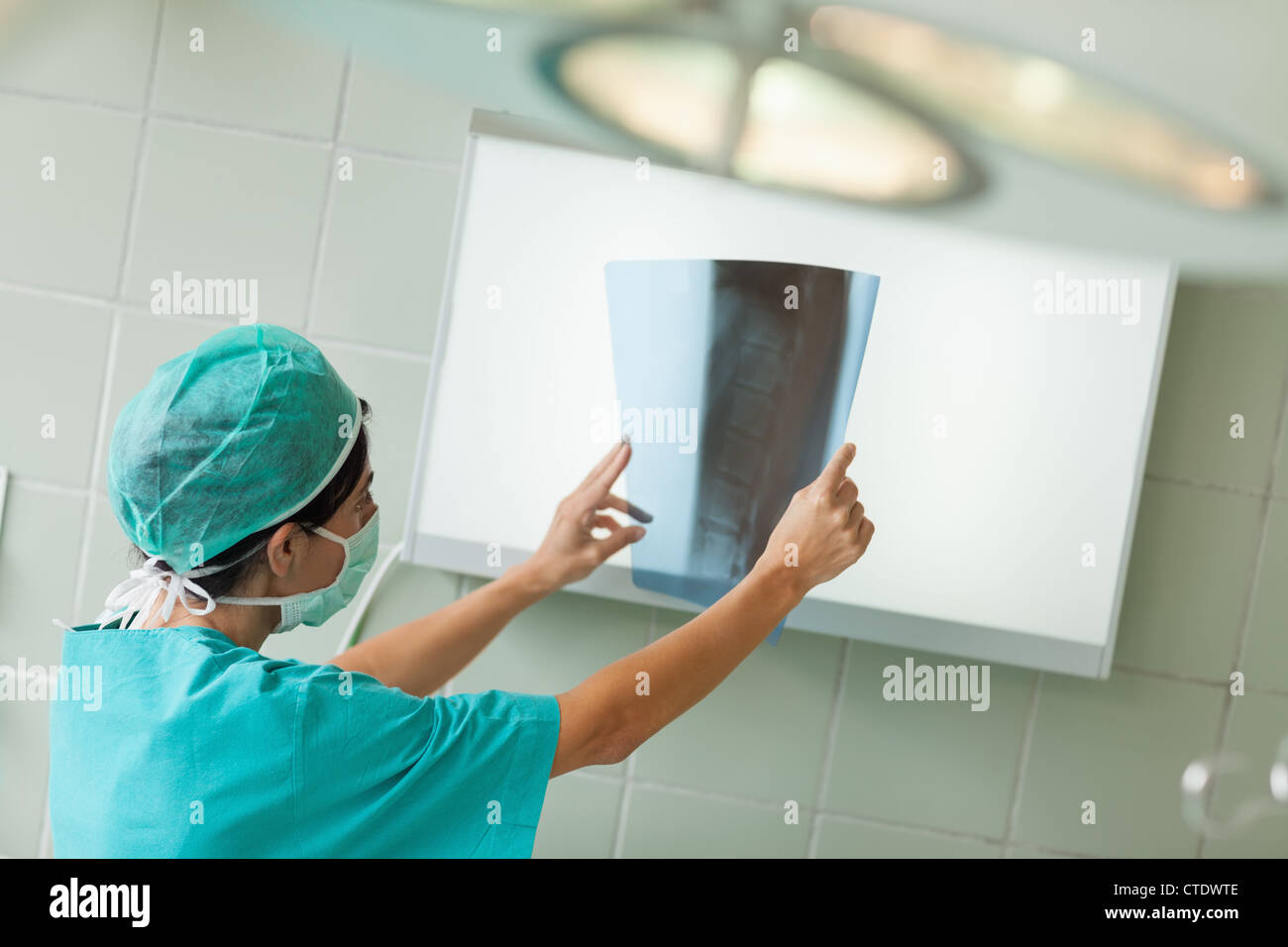 Surgeon looking at a radiography Stock Photo