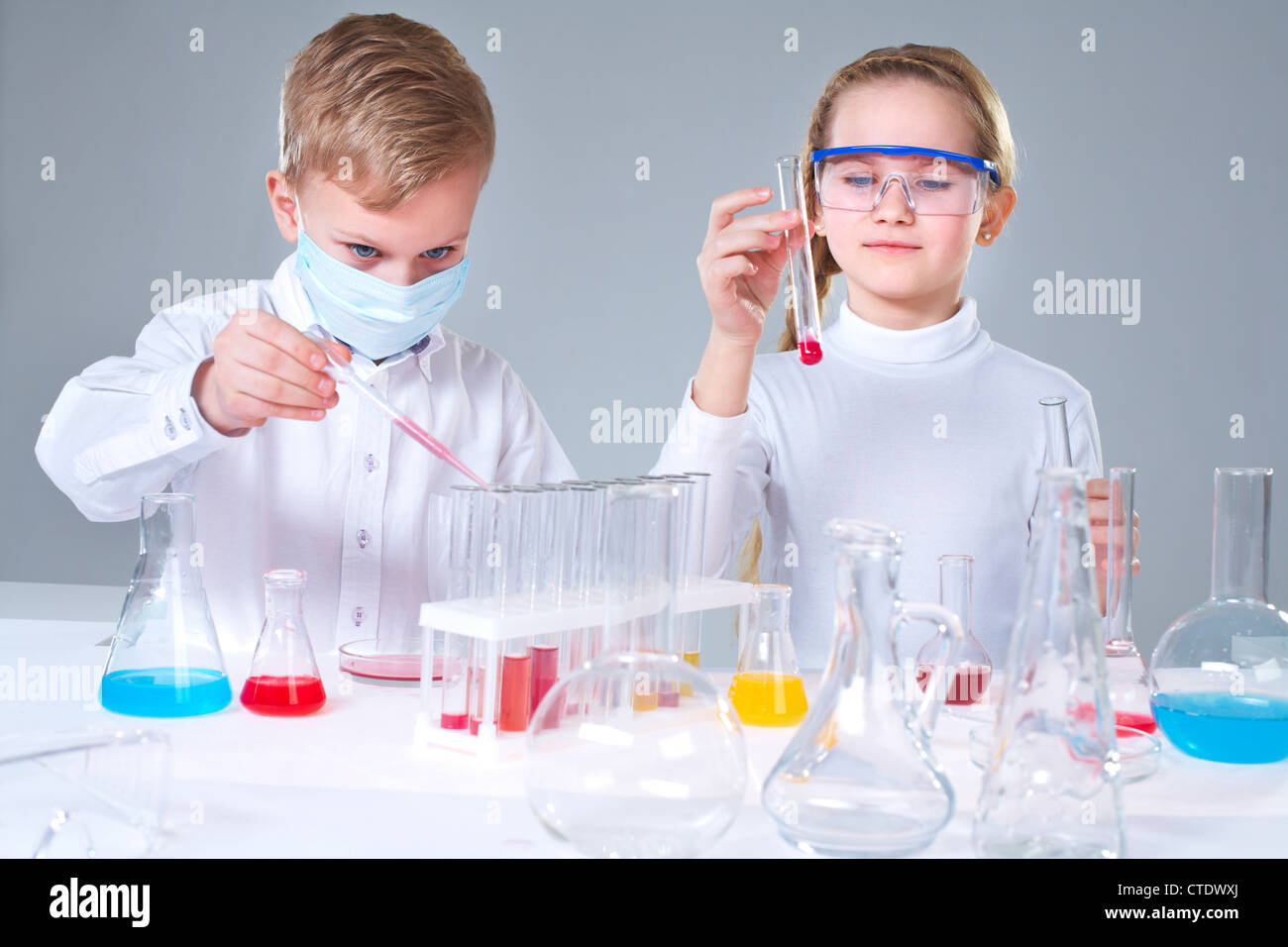 Team of young prodigies conducting scientific experiments Stock Photo