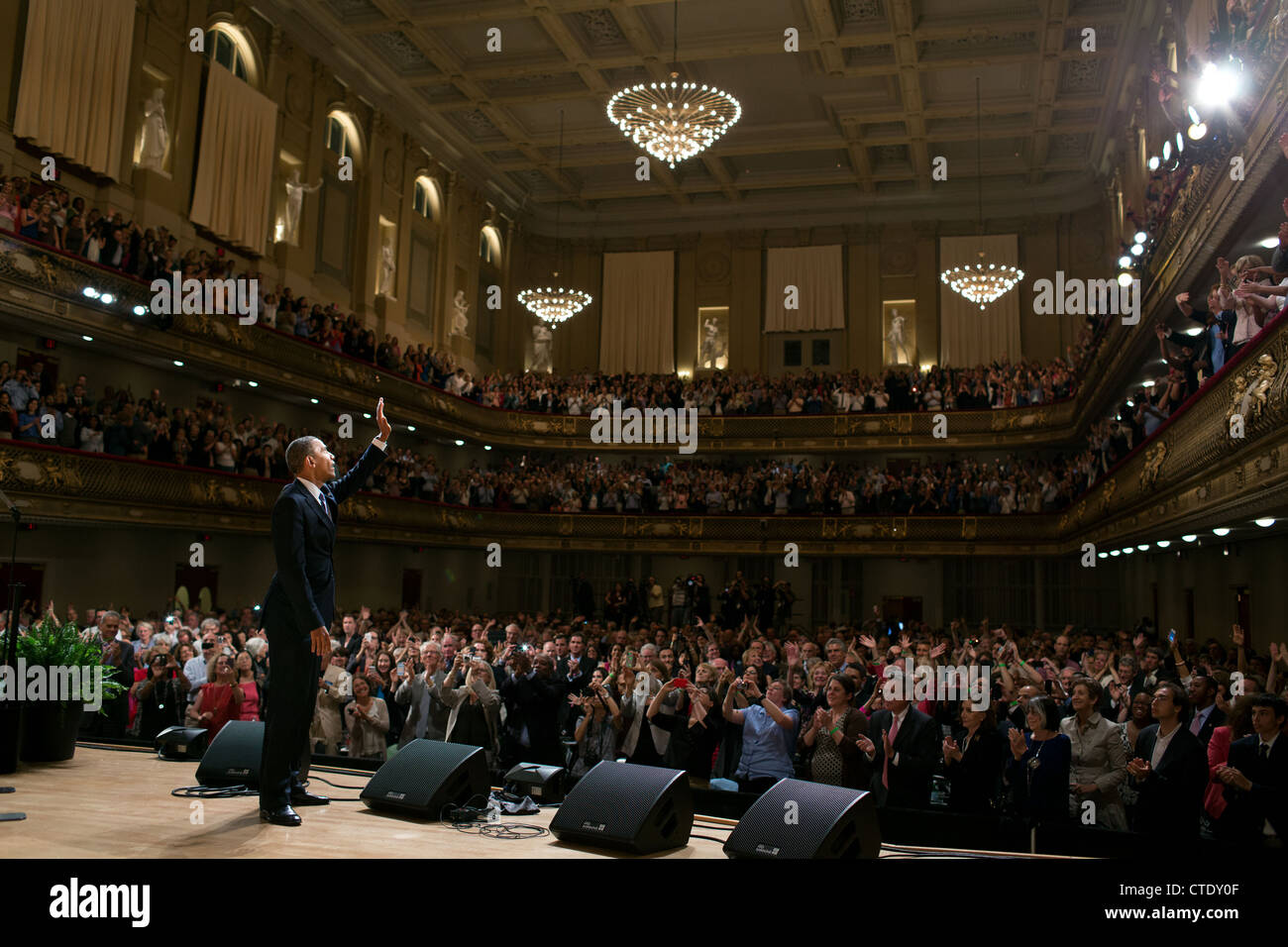 US President Barack Obama waives to the audience after delivering remarks at Symphony Hall June 25, 2012 in Boston, MA. Stock Photo