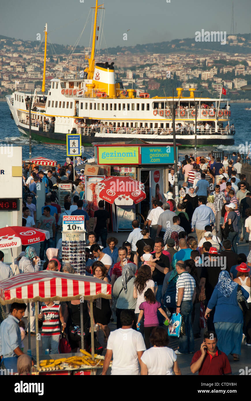 ISTANBUL, TURKEY. A lively, colourful scene at Eminonu ferry terminal on the Golden Horn. 2012. Stock Photo