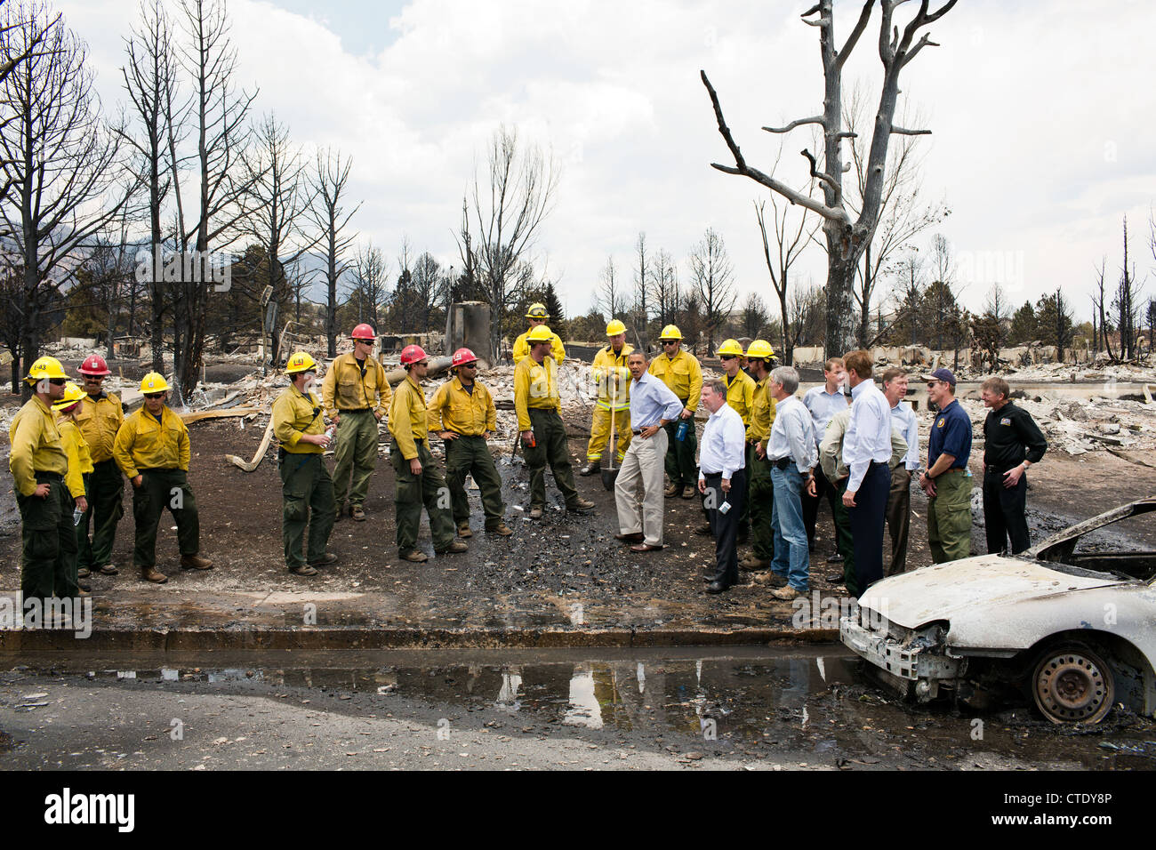 US President Barack Obama views fire damage with firefighters and elected officials June 29, 2012 in Colorado Springs, CO. Stock Photo