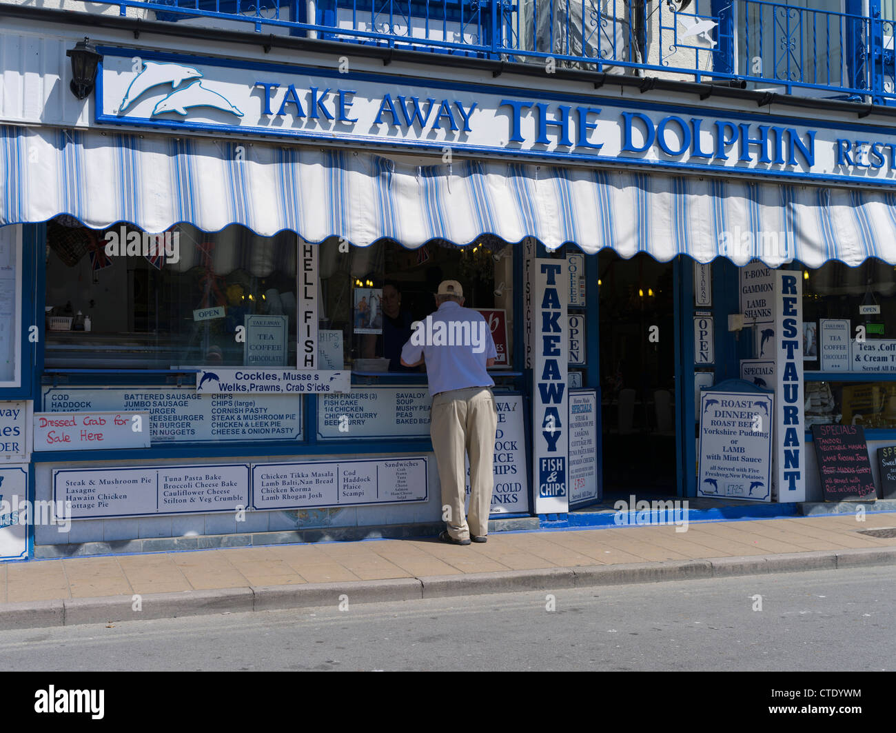 dh Dolphin Restaurant England UK ILFRACOMBE DEVON Traditional seaside cafe town seafront tourist fish chip takeaway restaurant chips britain Stock Photo