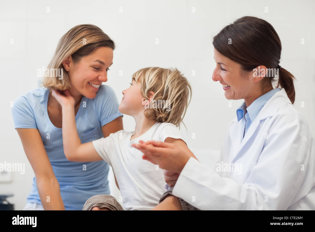 Child and his mother smiling Stock Photo - Alamy