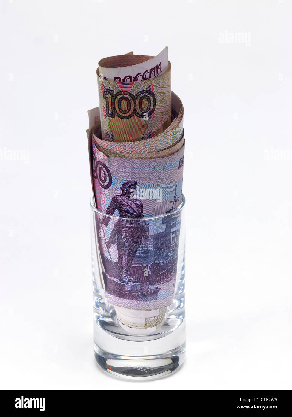 Russian ruble notes in a vodka shot glass Stock Photo