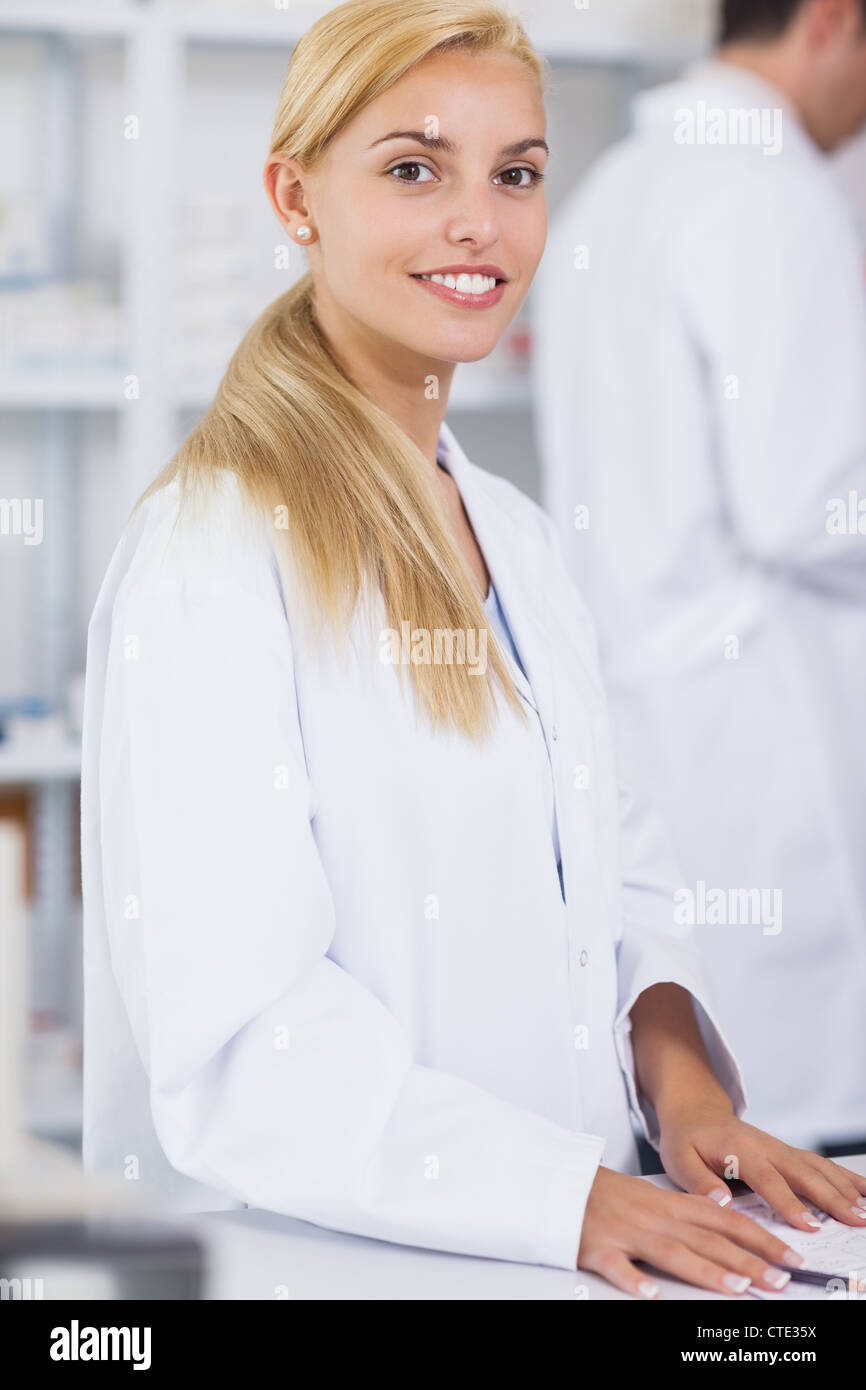 Smiling young blonde pharmacist hi-res stock photography and images - Alamy