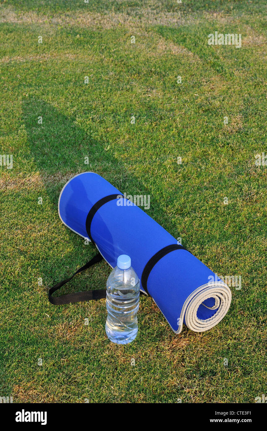 Yoga mat and water bottle Stock Photo