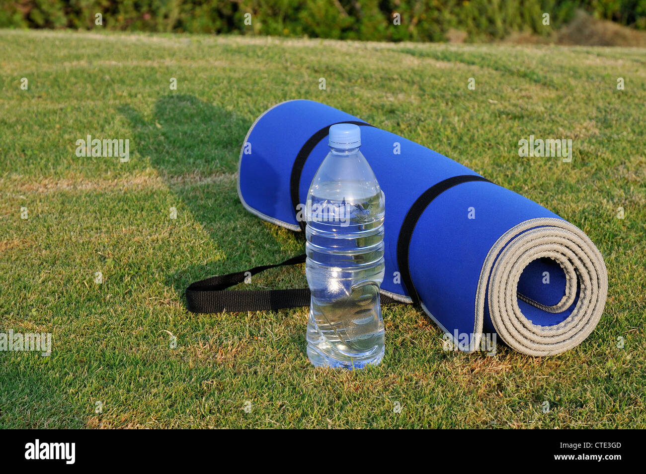 Yoga mat and water bottle Stock Photo