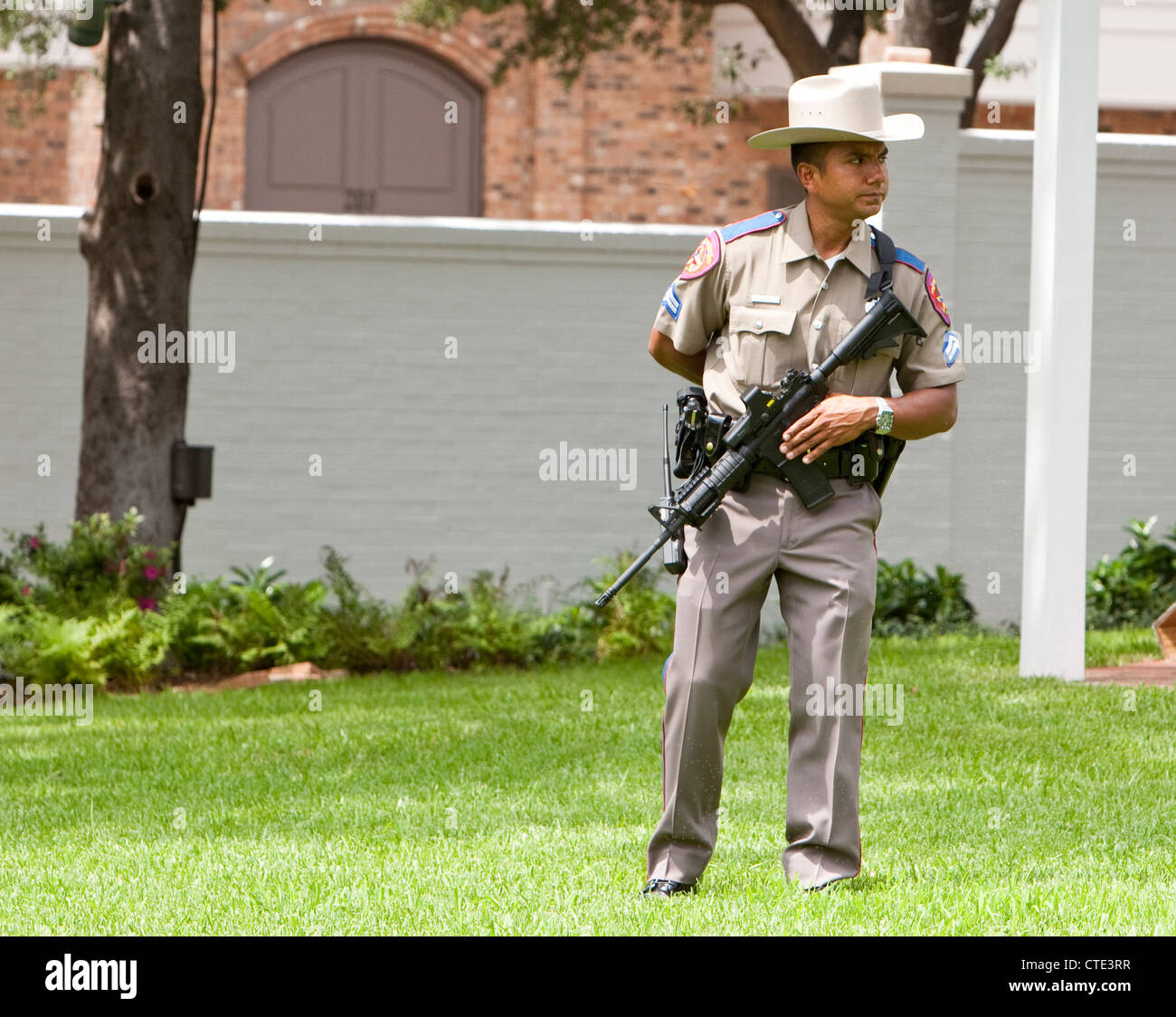 Officers with the Texas Department of Public Safety carry large weapons while on the Texas Governor's Mansion grounds. Stock Photo