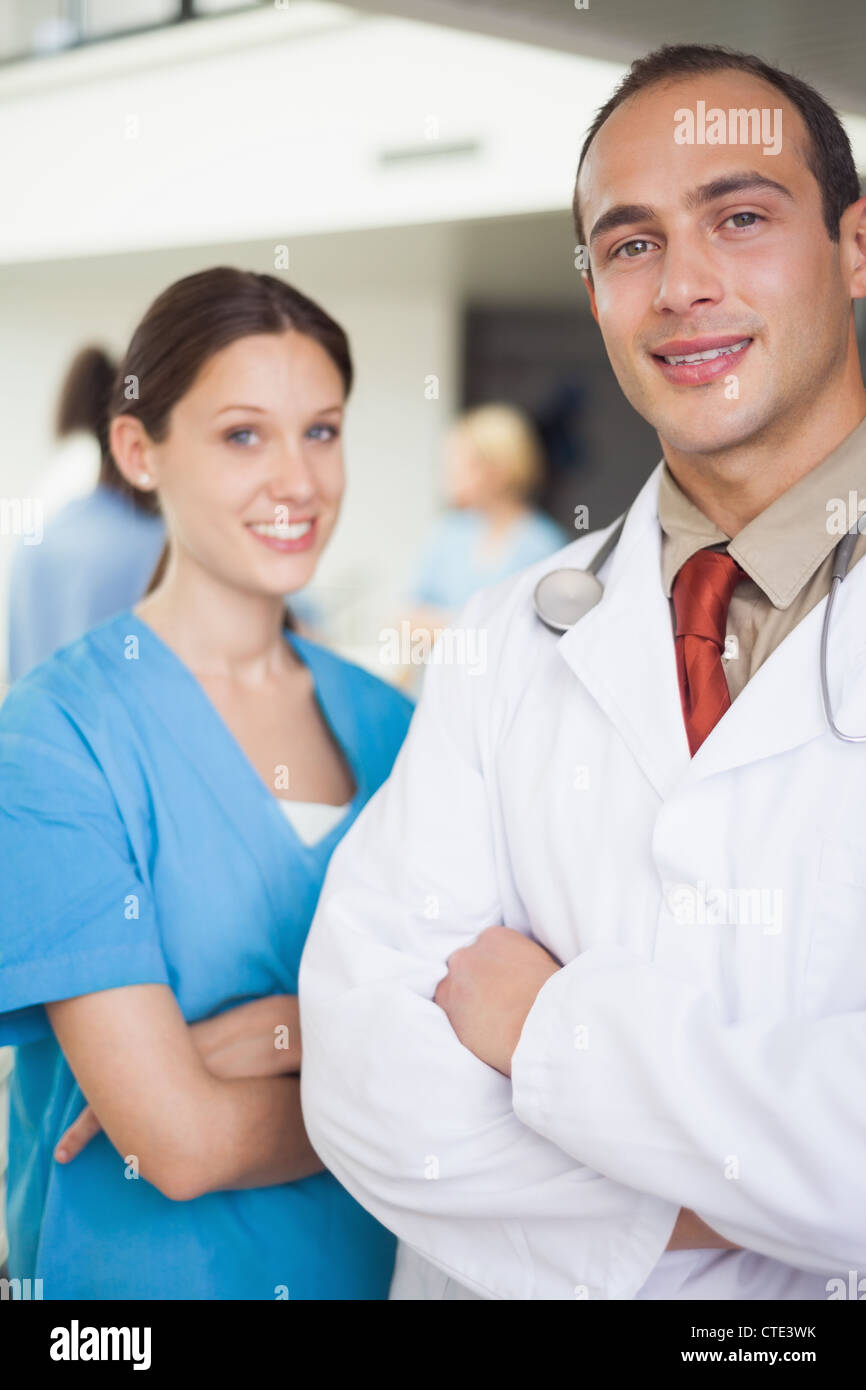 Doctor and nurse with arms crossed Stock Photo - Alamy