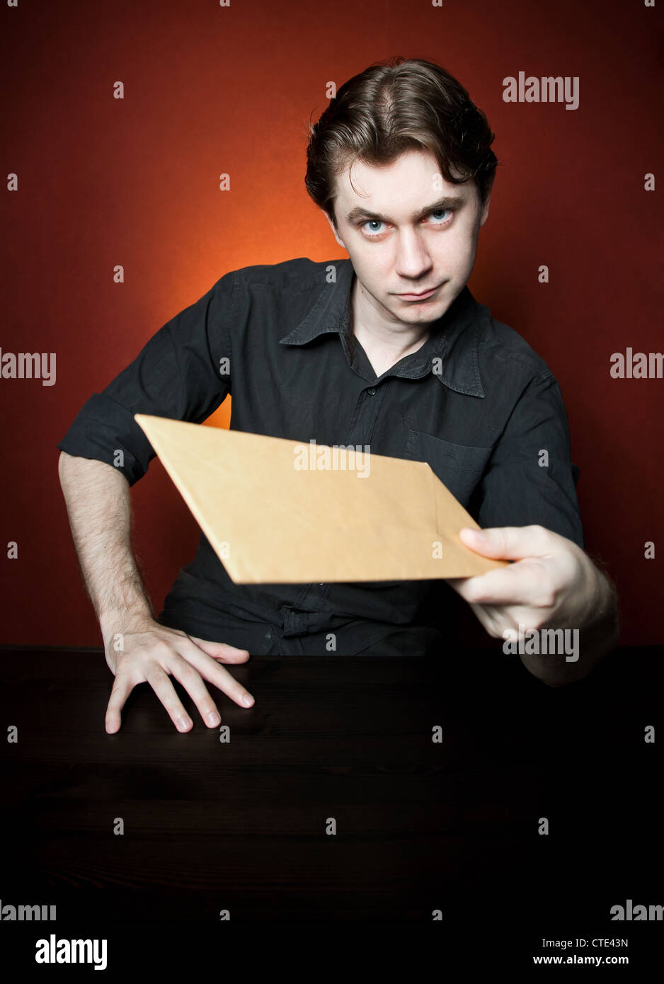 Young man with brown envelope Stock Photo Alamy