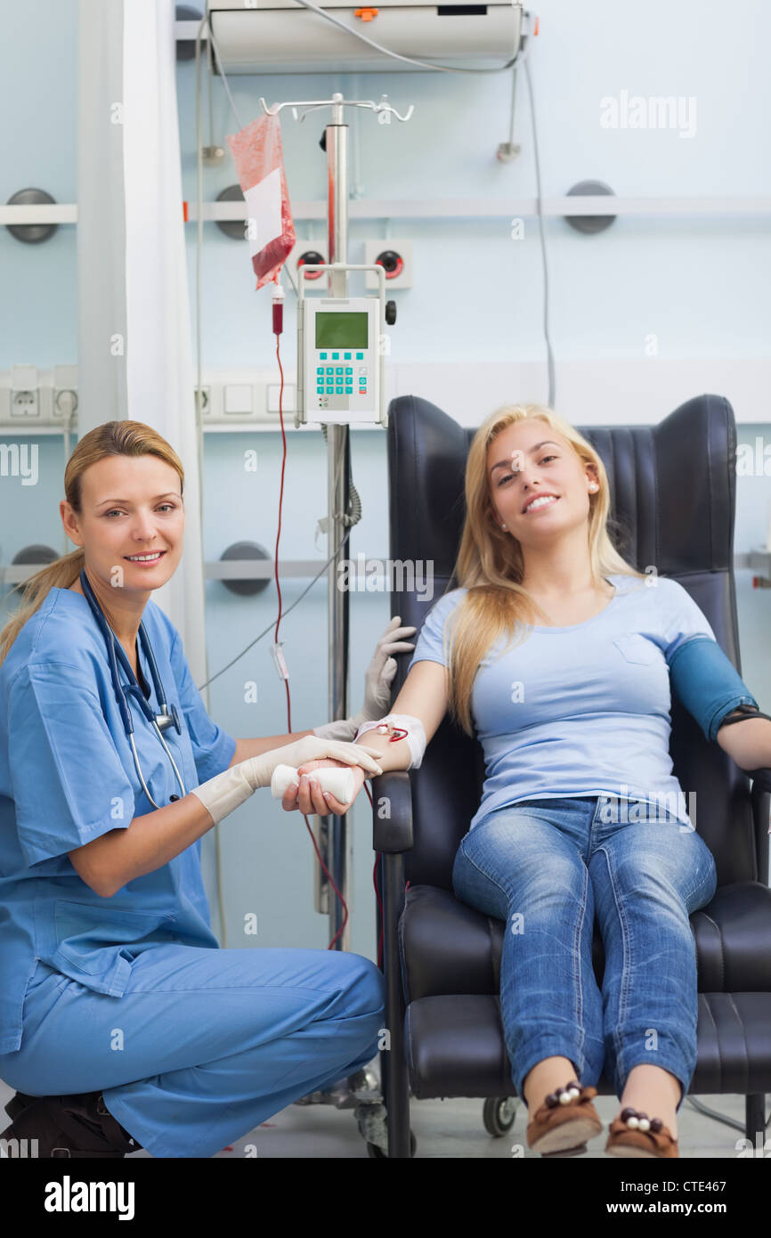 Female patient and nurse looking at camera Stock Photo - Alamy