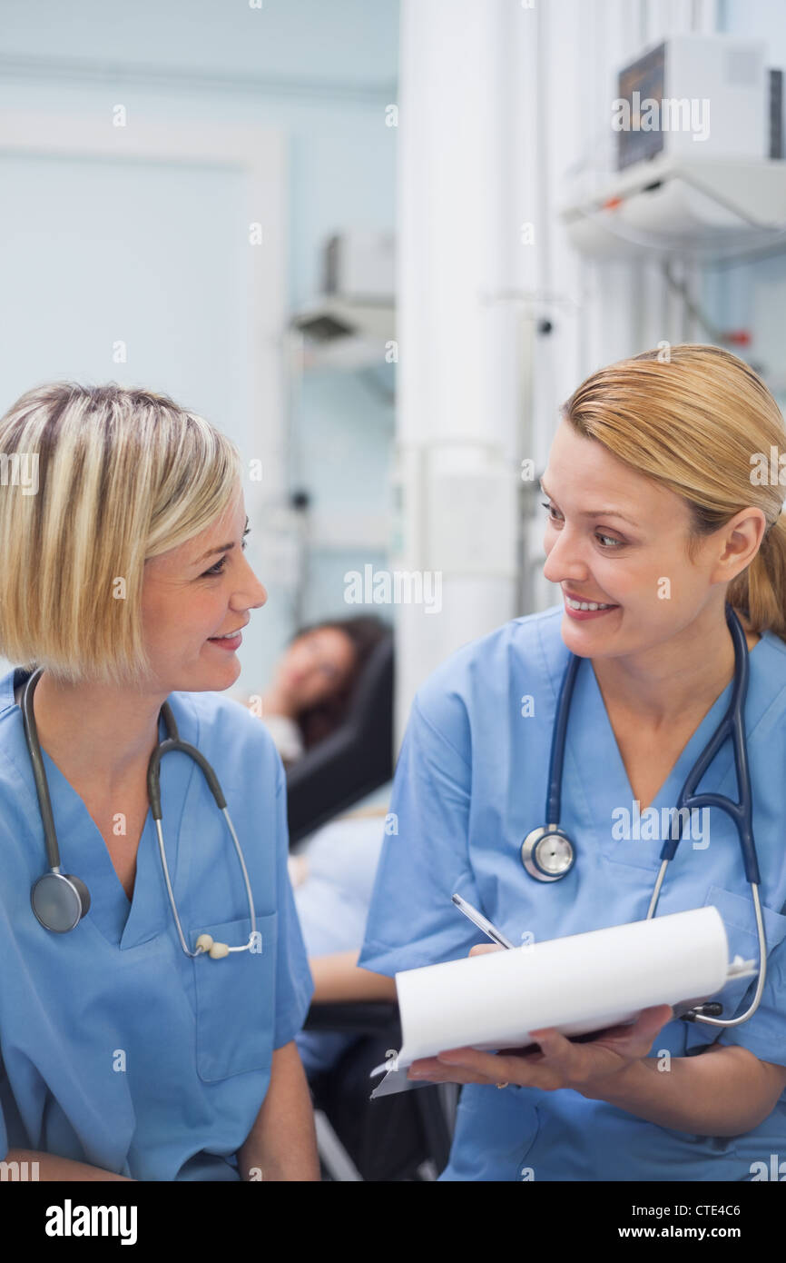 Smiling nurses speaking Stock Photo