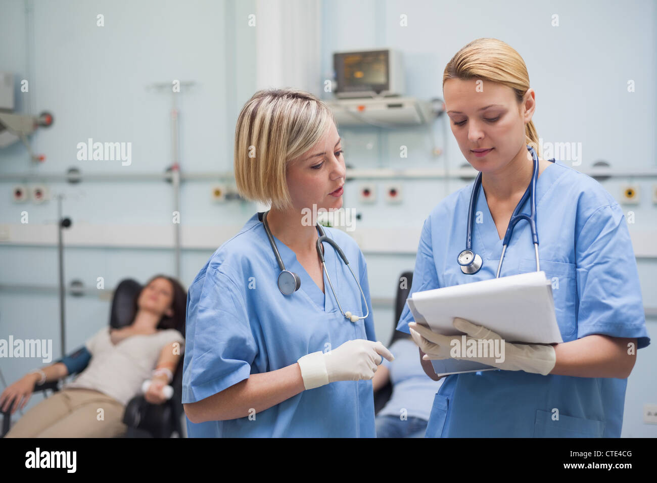 Nurses looking at a clipboard Stock Photo