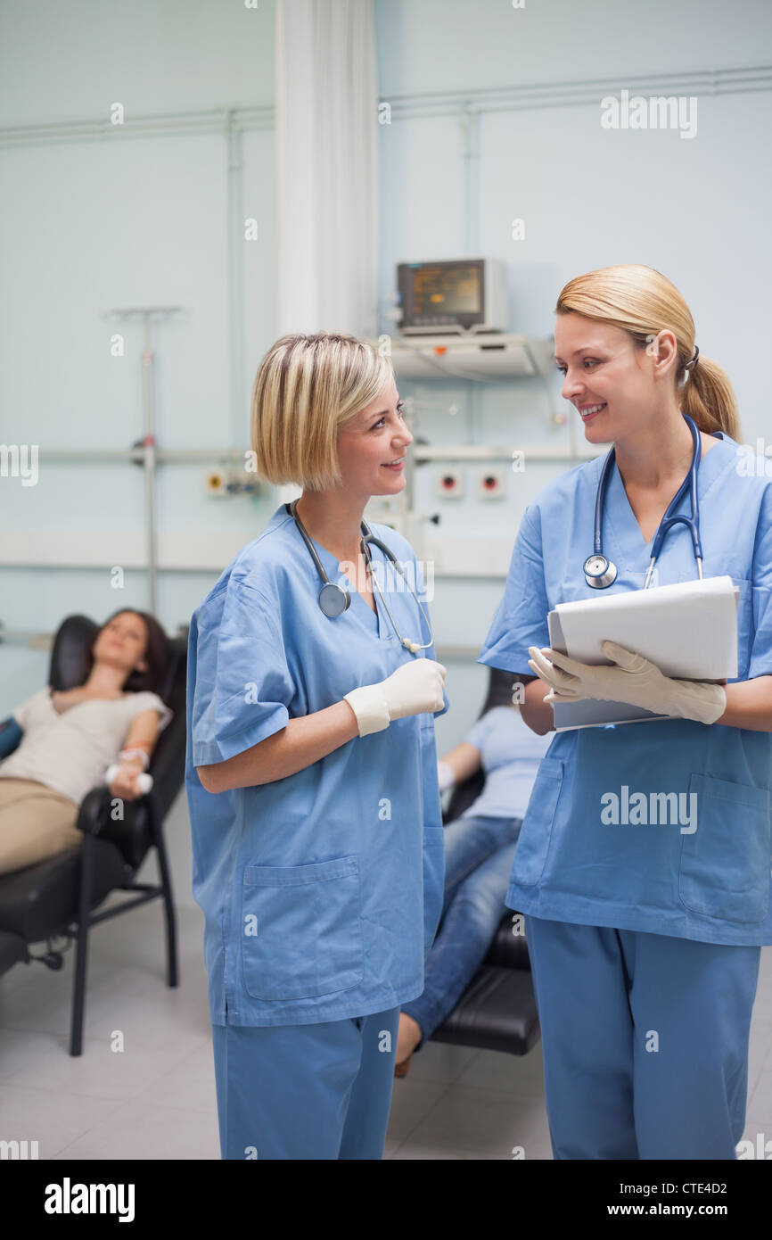 Nurses talking and smiling Stock Photo