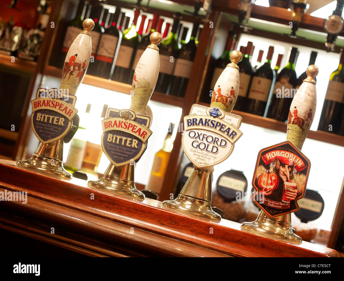 interior of a traditional British pub showing bar area and real ale hand pumps Stock Photo