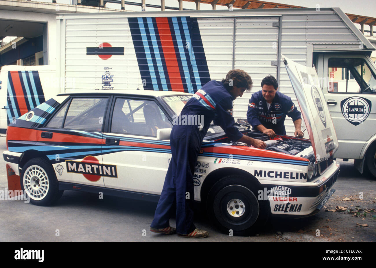 Lancia Martini rally team mechanics working on Miki Biasion 1990 Lancia HF Delta Integrale 16v rally car Stock Photo