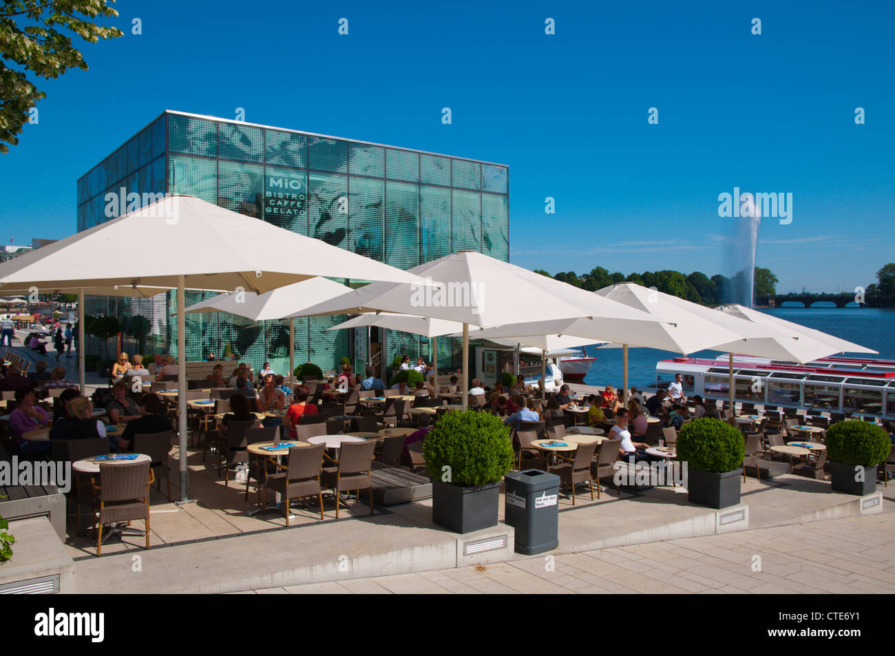 Restaurant cafe terrace outside Ice Cube building Binnenalster lakeside Mitte central Hamburg Germany Europe Stock Photo