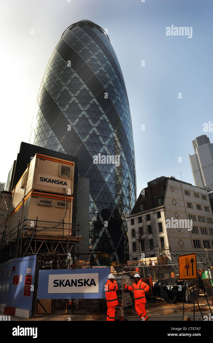The Gherkin Building with new development being built next to it, London City UK Stock Photo