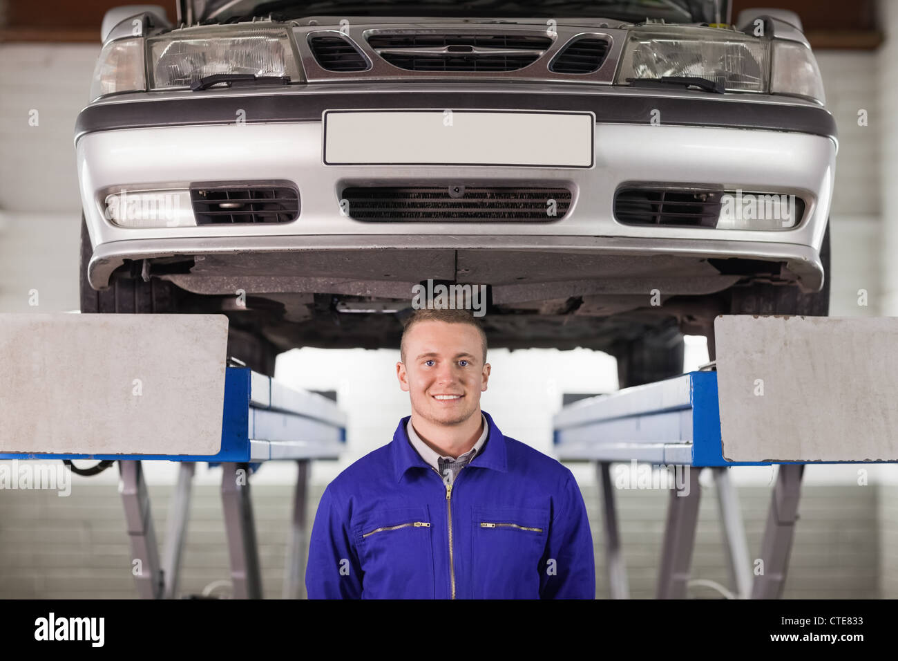 Mechanic below a car Stock Photo - Alamy