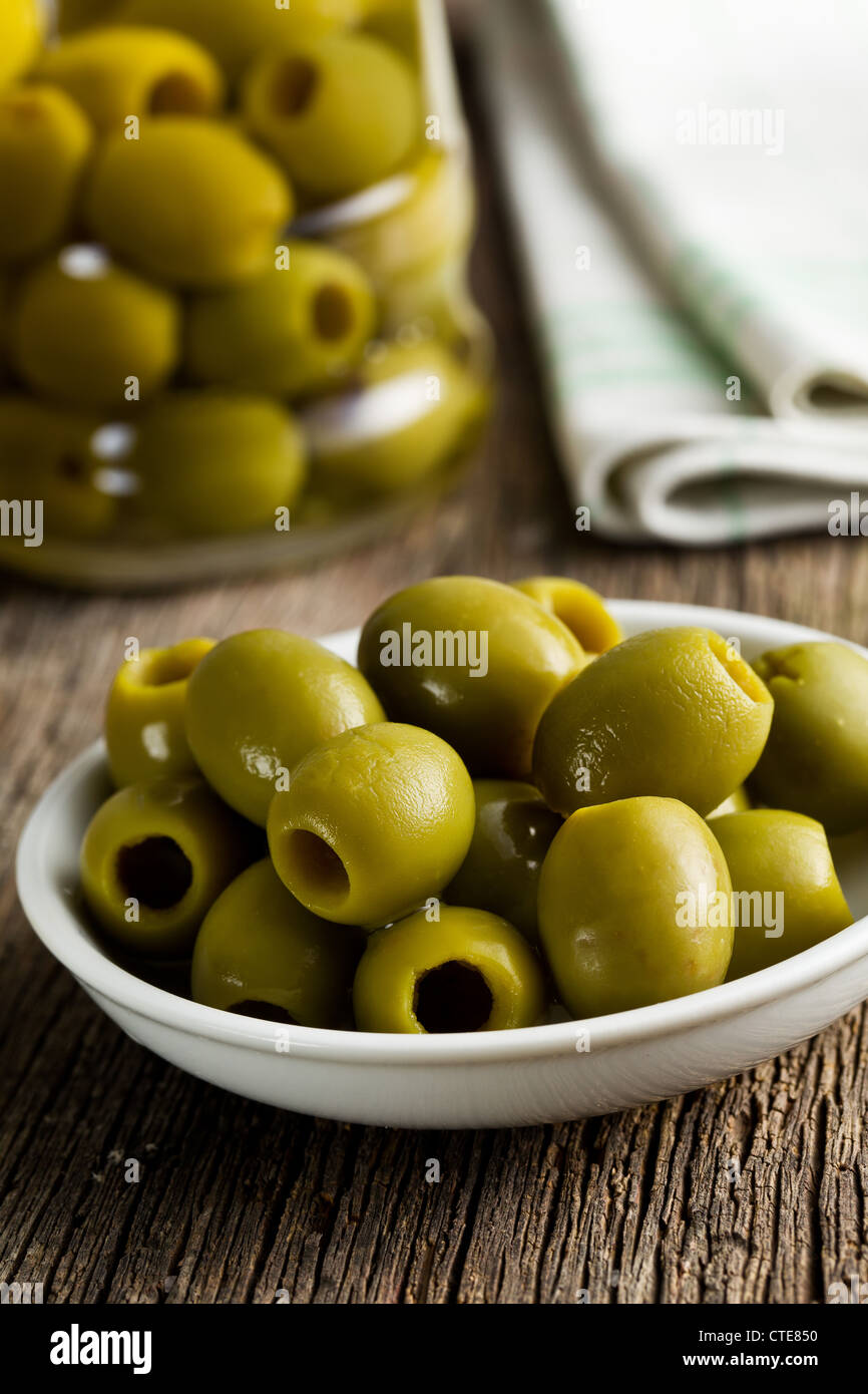 the green olives on kitchen table Stock Photo