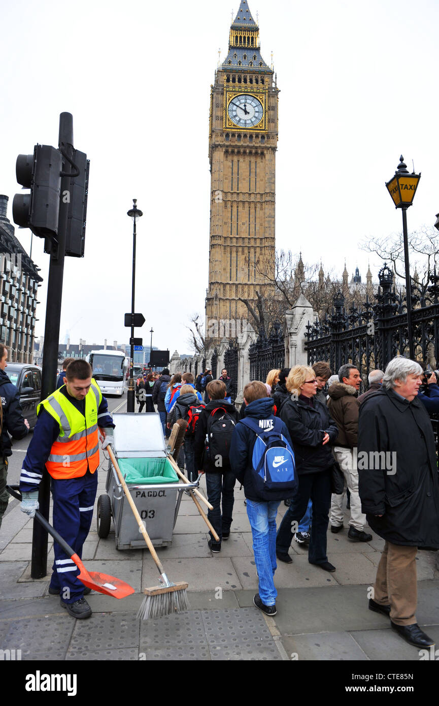 A street cleaner works near Big Ben, Houses of Parliament, London UK Stock Photo