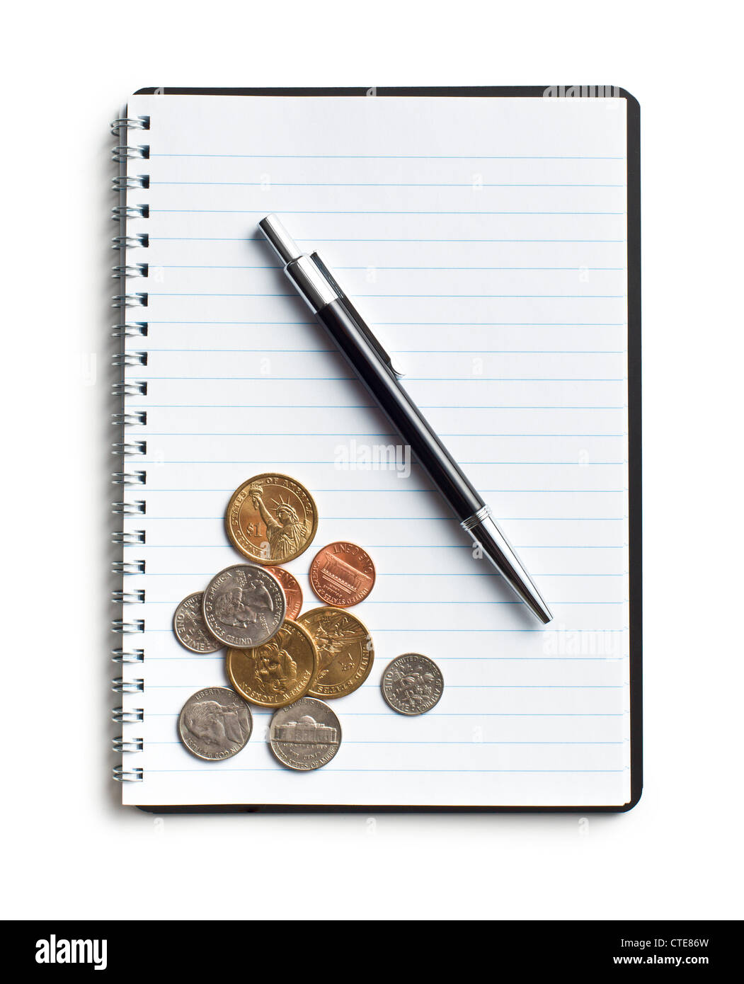 american coins and pen on blank notebook Stock Photo