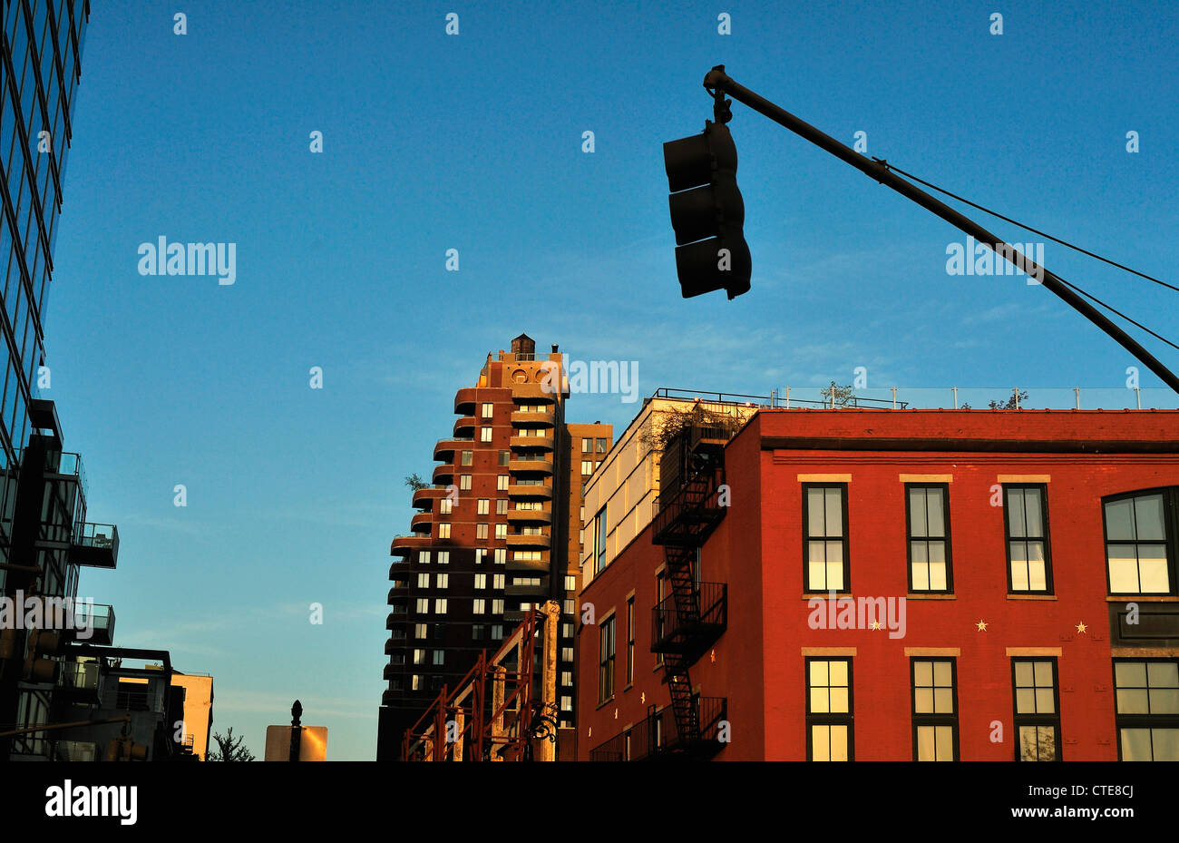 Stop light with buildings at sunset in lower Manhattan Stock Photo