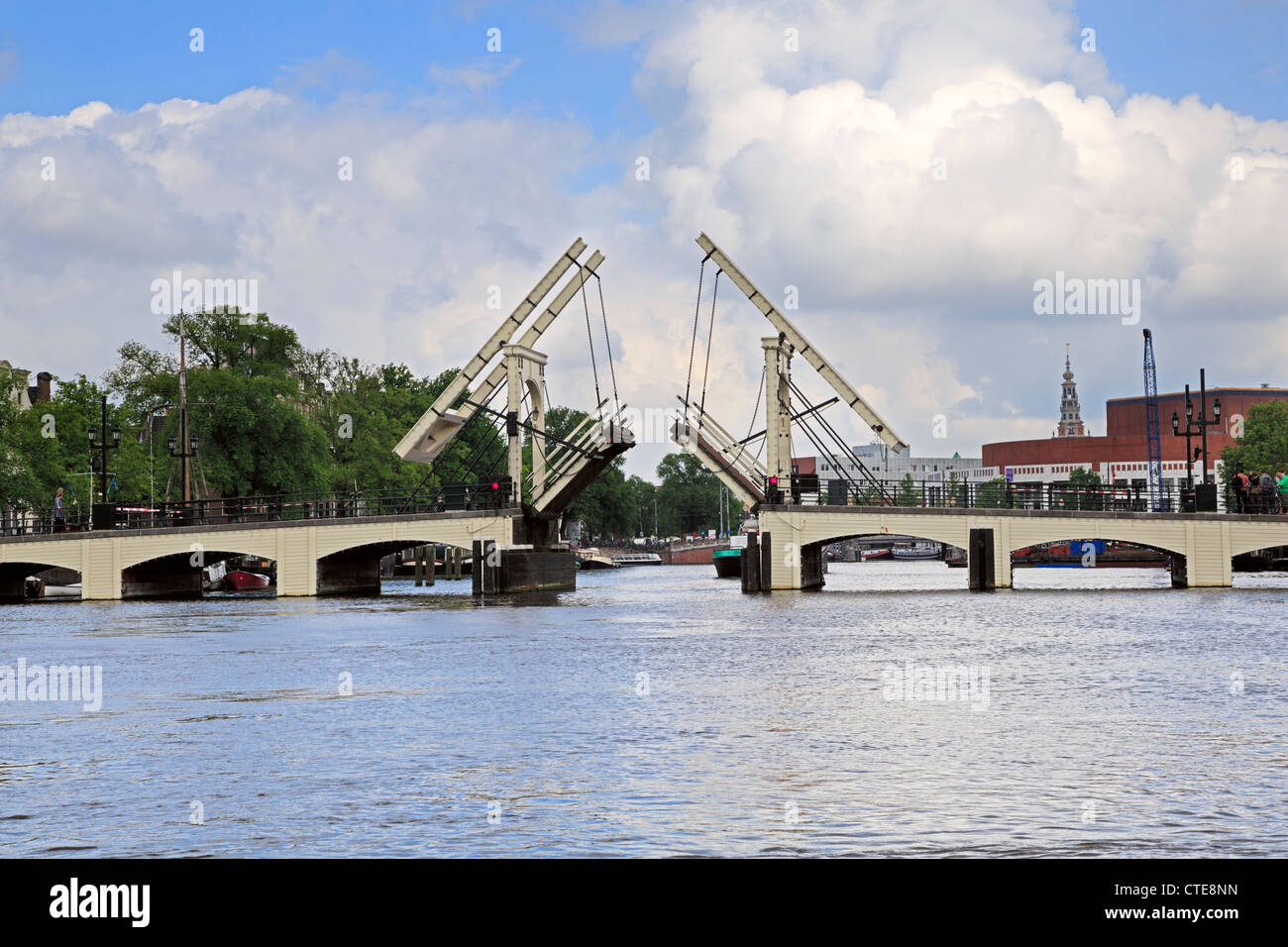 The Skinny Bridge on the Amstel River closes after a tanker has passed through. Stock Photo