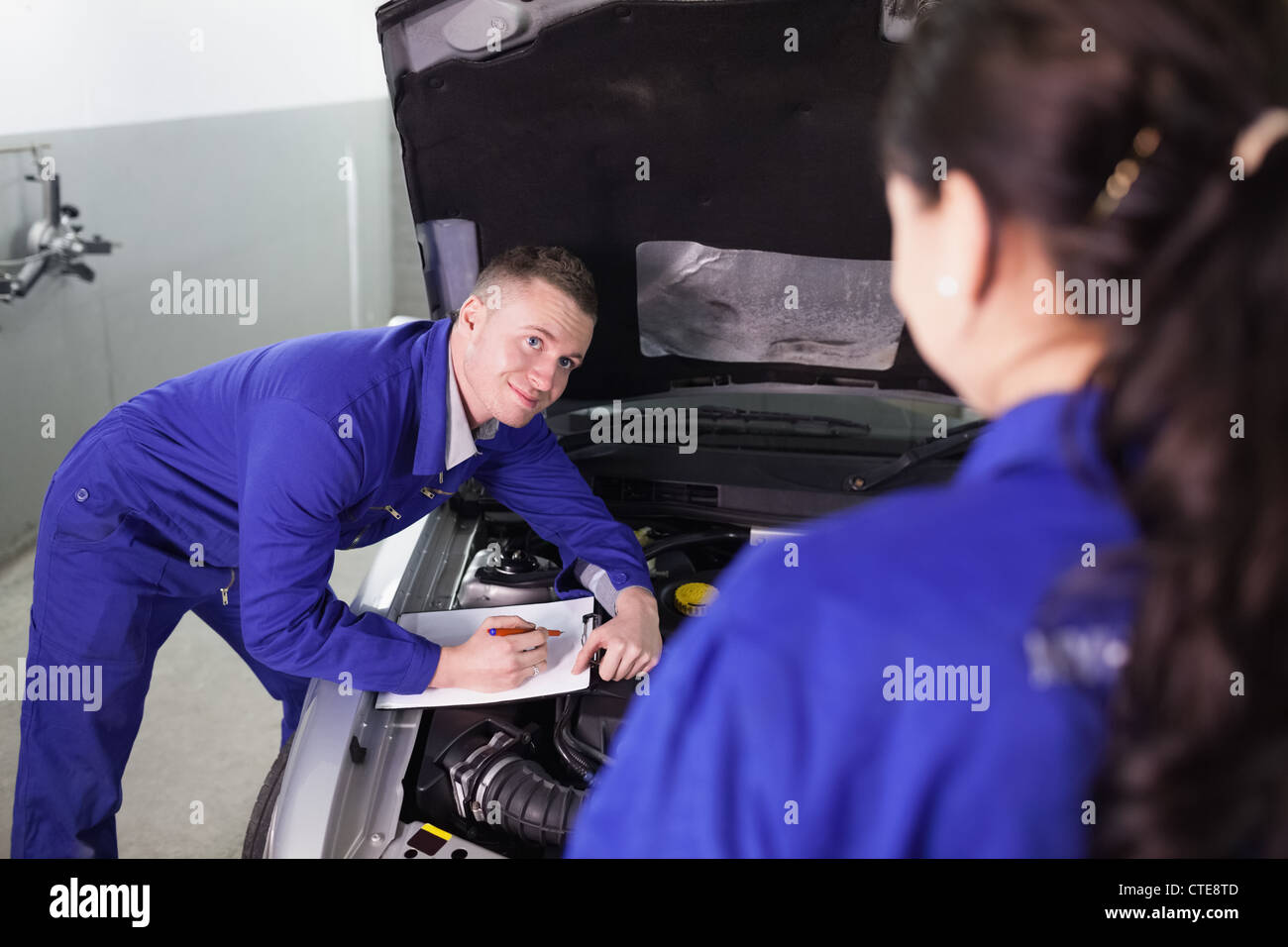 Mechanic leaning on machine hi-res stock photography and images - Alamy