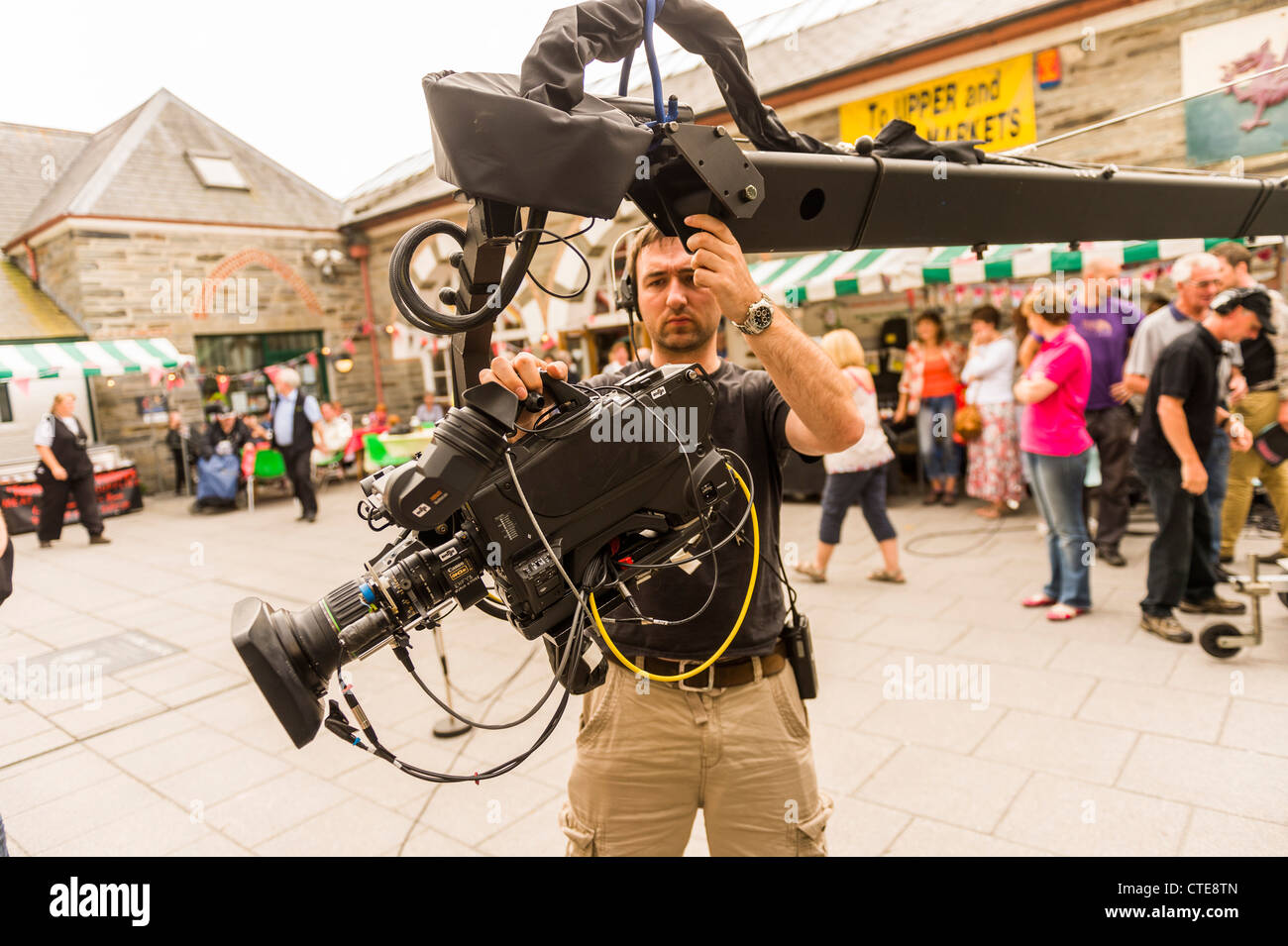 A camera operator setting up a job for a live television TV on location outside broadcast, UK Stock Photo