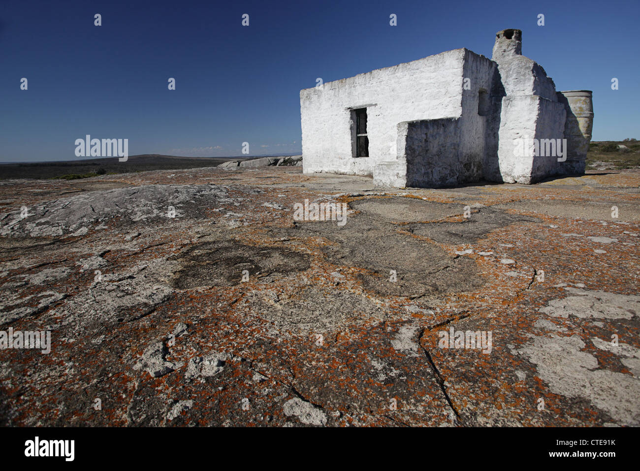Old abandoned house on the rocks Stock Photo