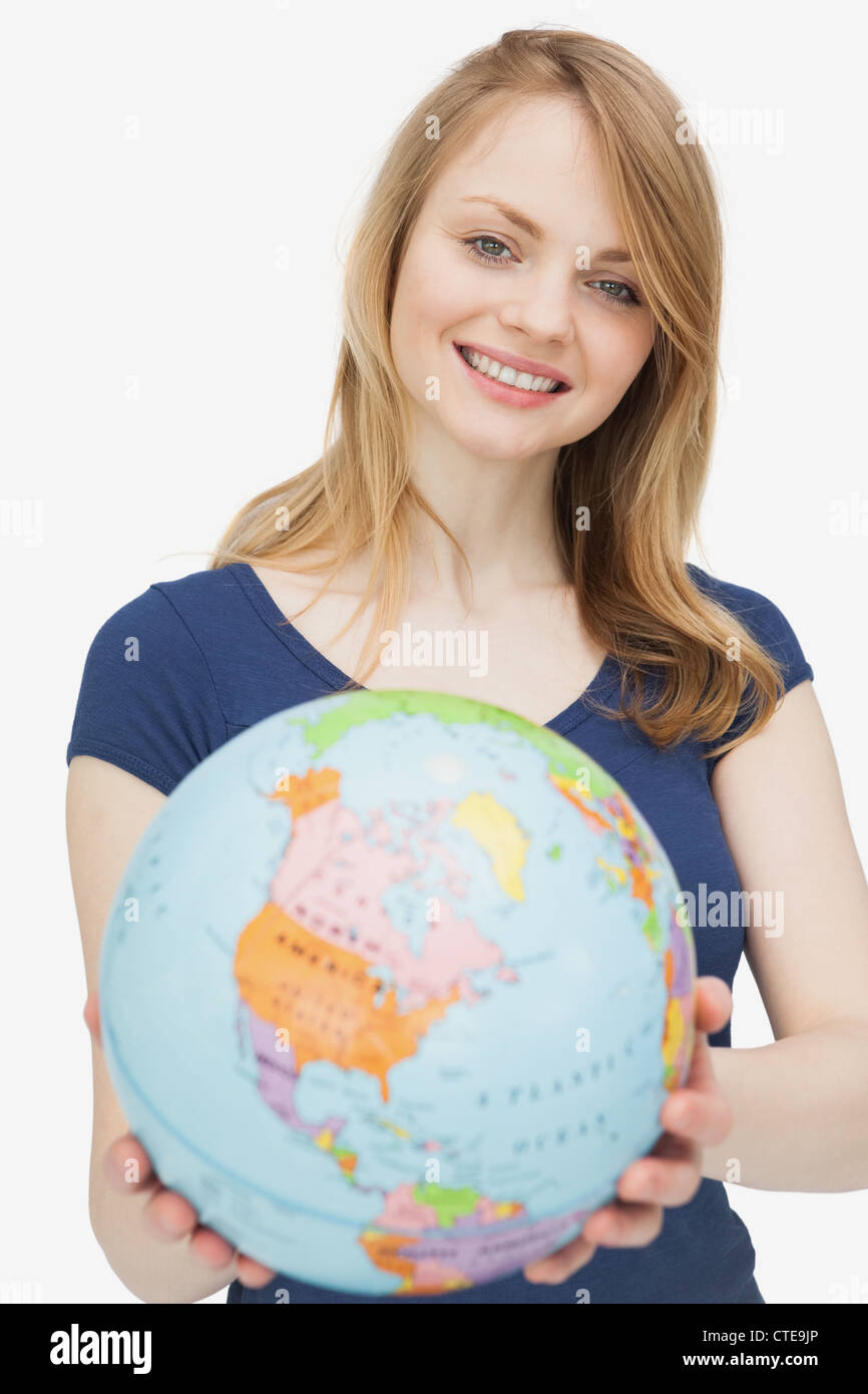 Woman holding a globe Stock Photo