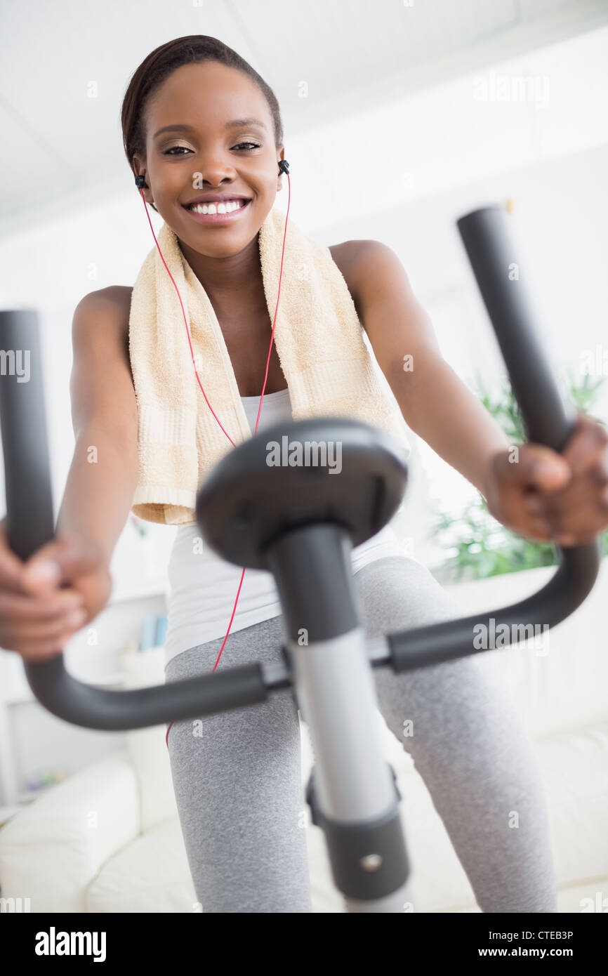 Front view of a black woman doing exercise bike Stock Photo