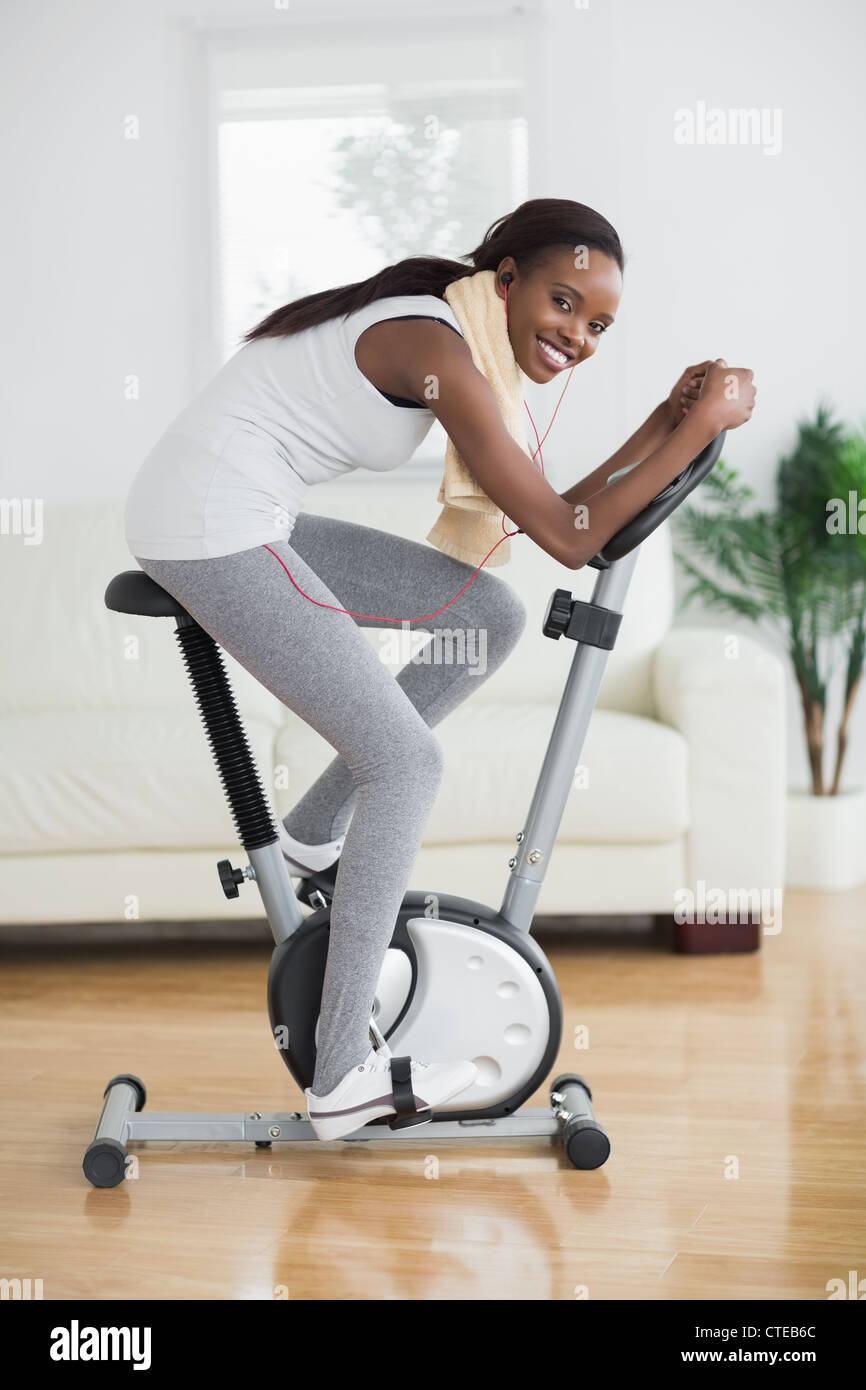 Side view of a concentrated black woman doing sport Stock Photo