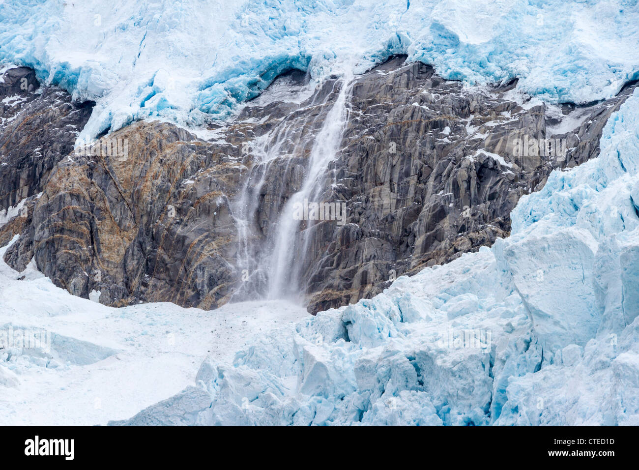 Calving on the upper layers of Northwestern Glacier in the Kenai Fjords National Park in Alaska. Stock Photo