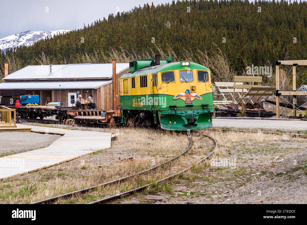 In Carcross, Yukon Territory, Canada, the White Pass (WP&YR) trains are working trains, pulling freight and cargo cars. Stock Photo
