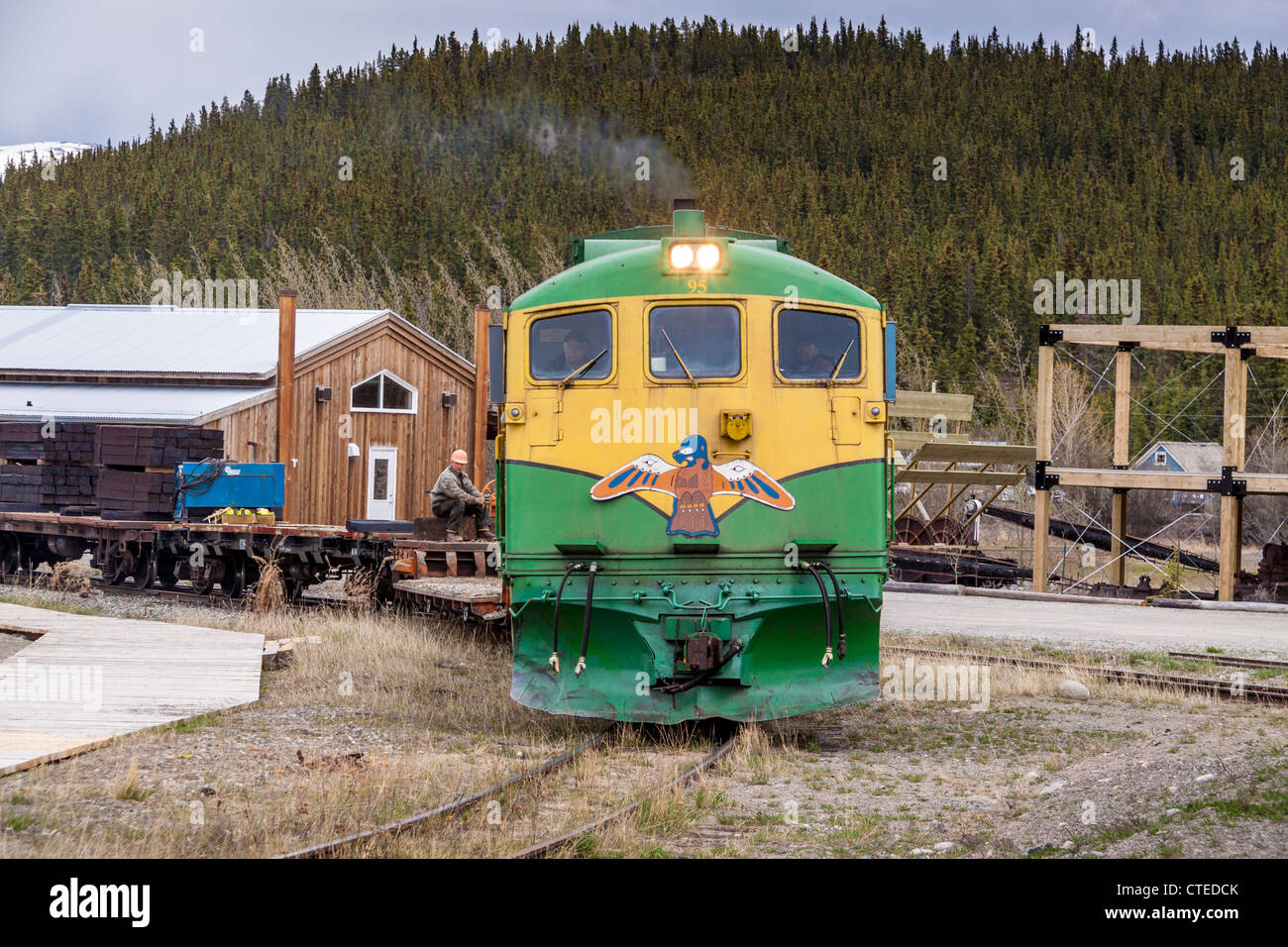 In Carcross, Yukon Territory, Canada, the White Pass (WP&YR) trains are working trains, pulling freight and cargo cars. Stock Photo