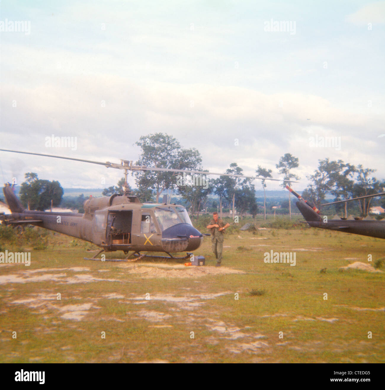 Huey helicopter parked at Landing Zone during Vietnam War B Model Stock Photo