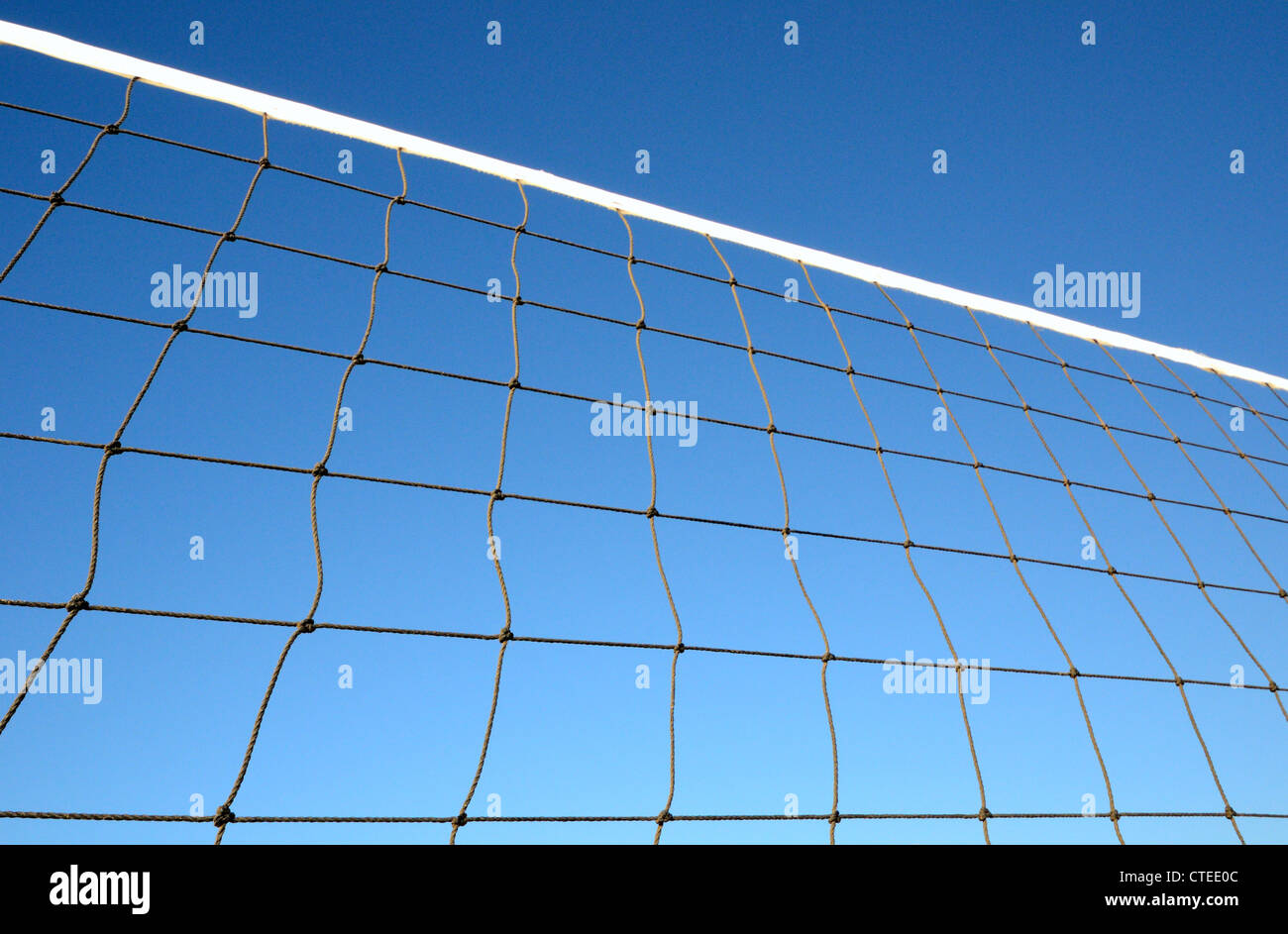 Part of volleyball net against clear blue sky Stock Photo
