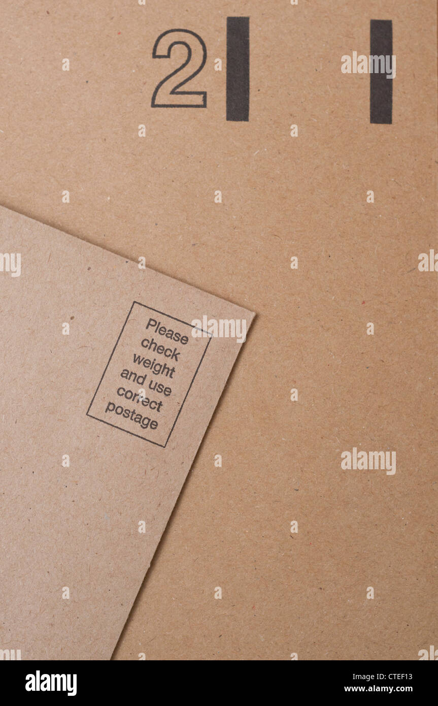 Postage required and postage paid brown return envelopes Stock Photo