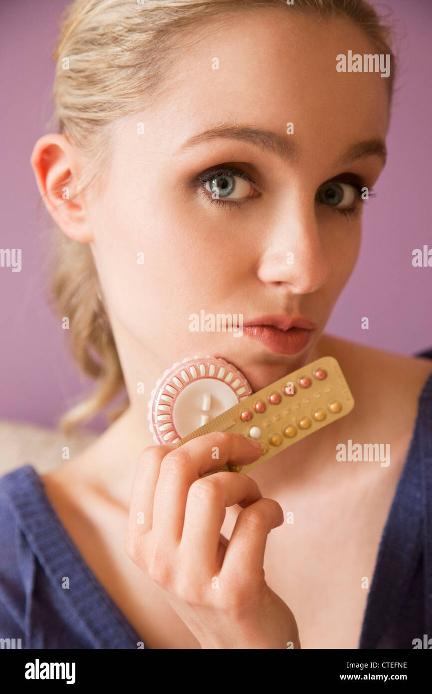 portrait of a woman with birth control pills Stock Photo