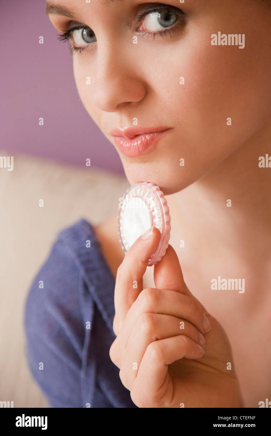 Woman with birth control pills Stock Photo