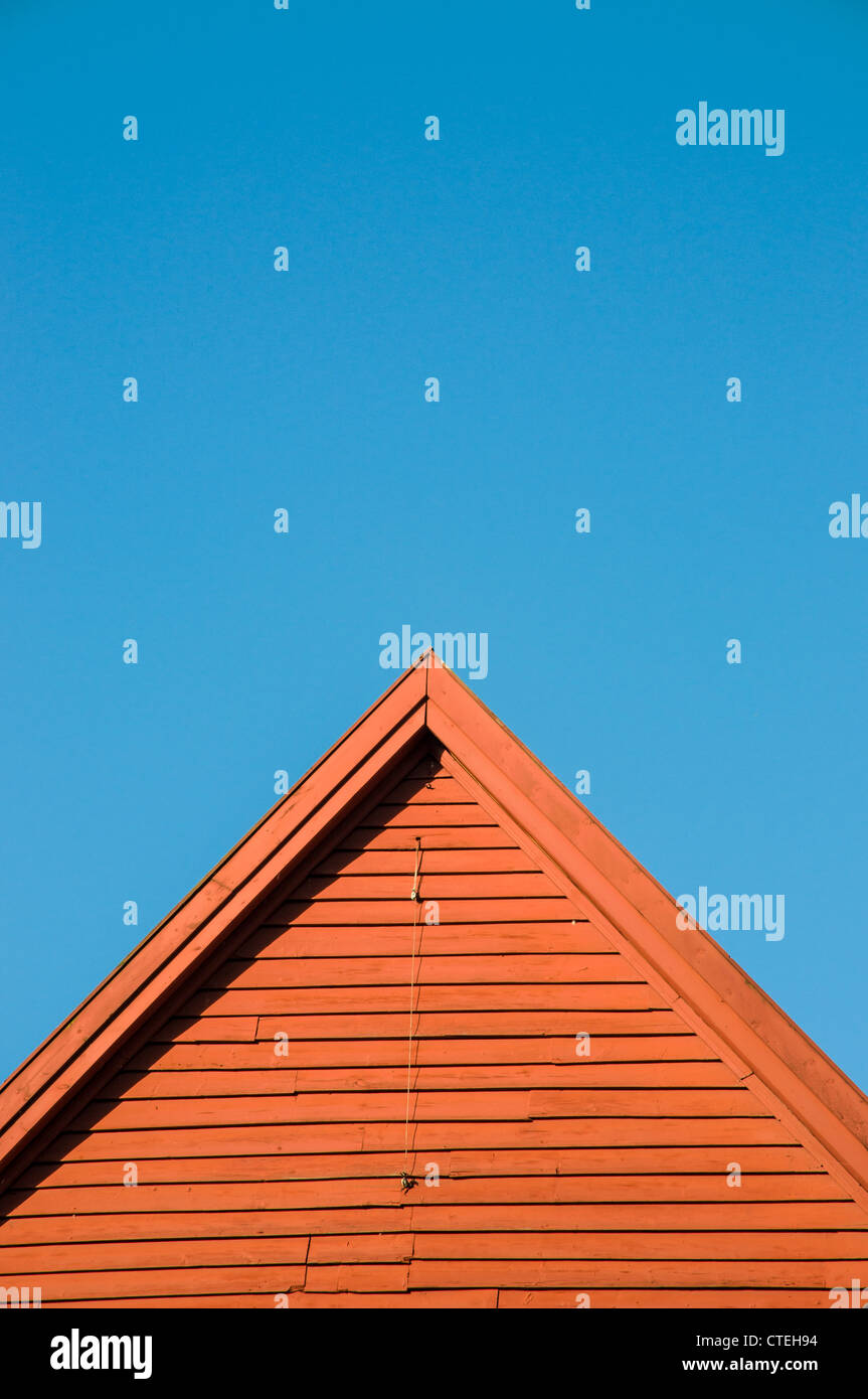 Norwegian wood house against a blue sky, Stock Photo