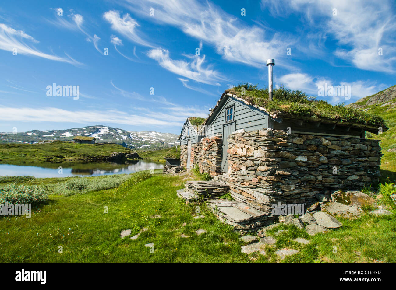 Huts made of stone and wood on the Hardangervidda, a high plateau in Norway Stock Photo